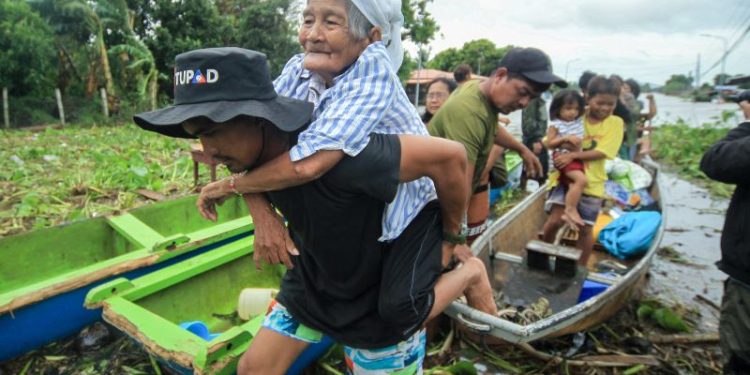 Tropical Storm Trami brings severe flooding and landslides to the Philippines, at least two dozen dead